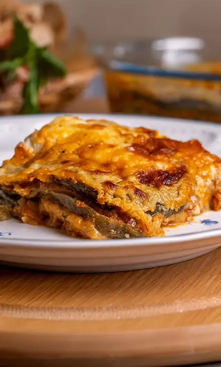 A plate with a square piece of mousaka