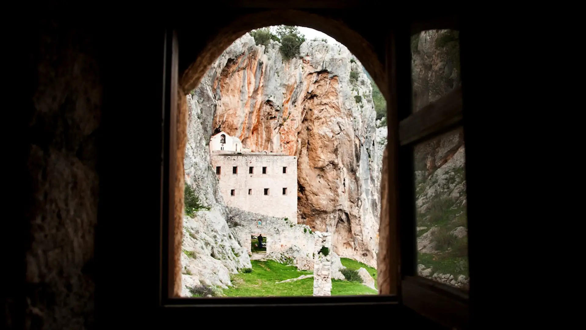 View of Avgo monastery from a small window in a dark room