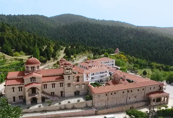Impressive stone built monastery in the green slopes of mount Parnonas